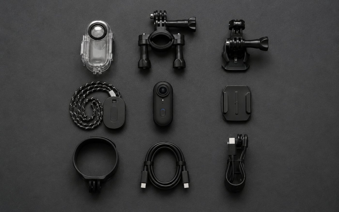 The complete Treklon 4S bundle laid out: camera, waterproof case, pendant, mounts, and cable